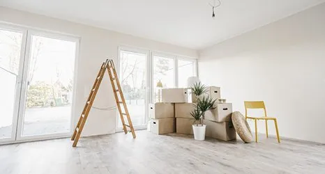 Moving home ladder and cardboard boxes